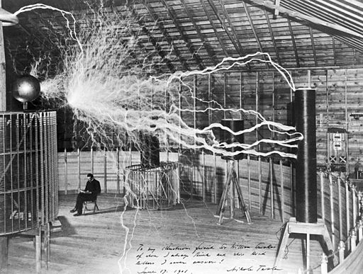 Nikola Tesla with his equipment